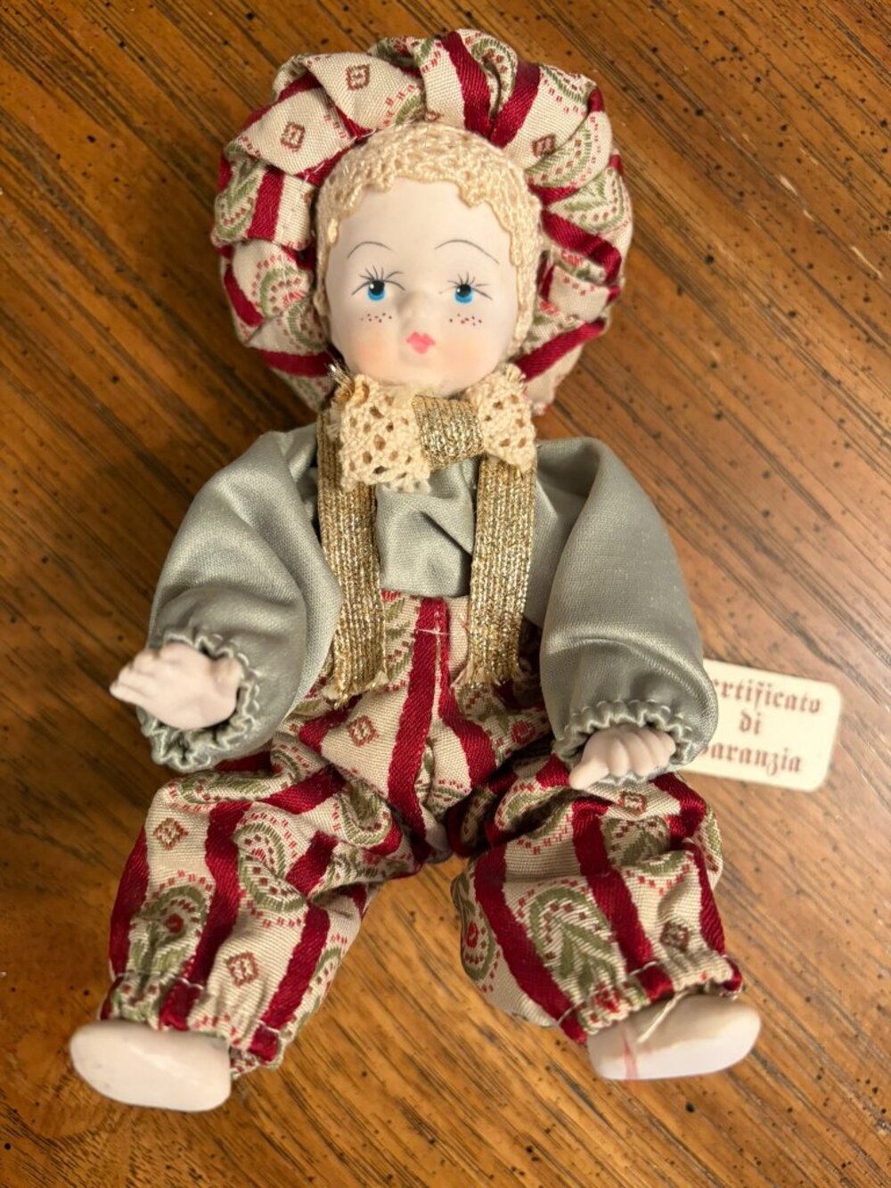 Porcelain capodimonte made Italy figurine boy with a Big puffy hat and matching
